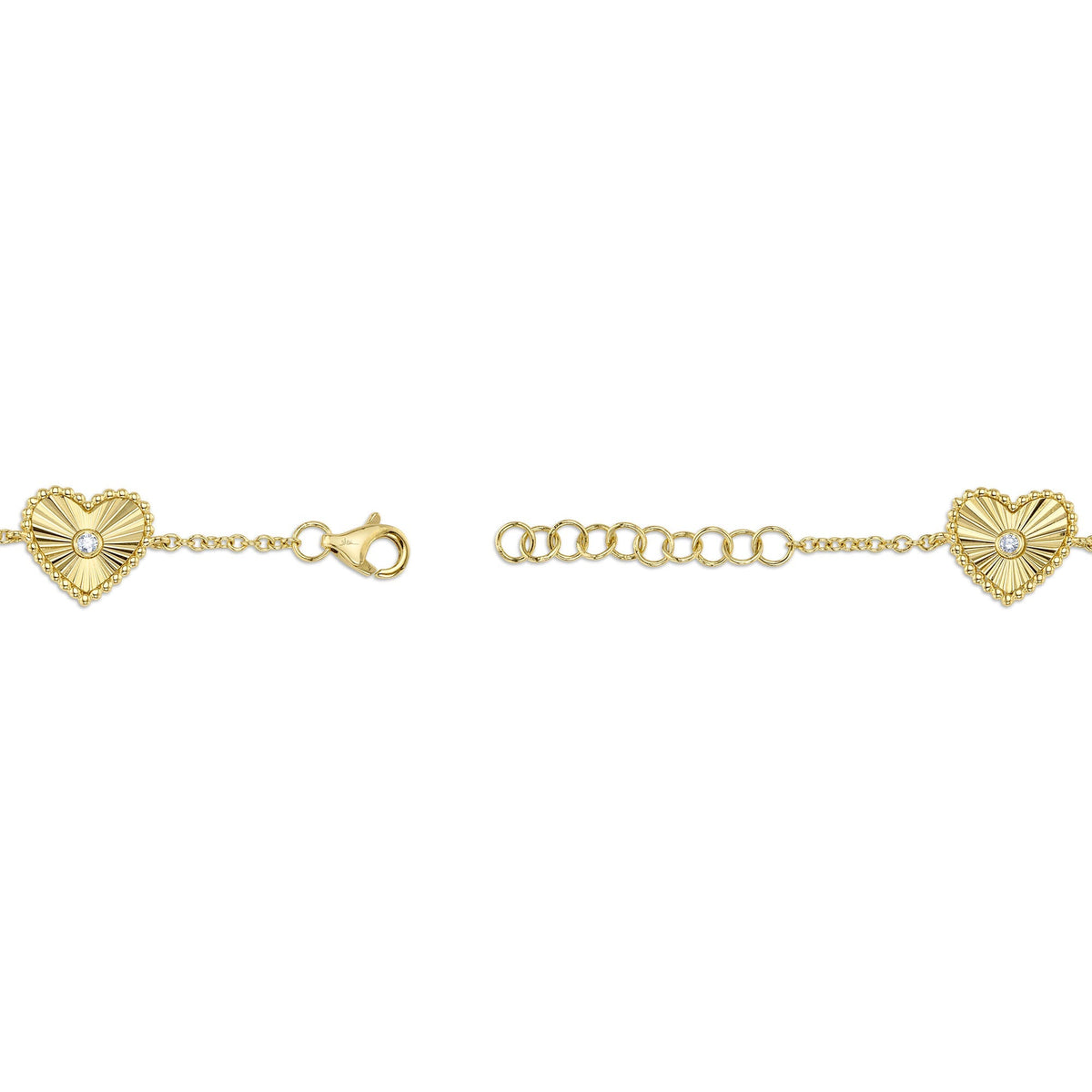 0.10CT 14K Y/G DIAMOND BEZEL RIBBED HEART BRACELET