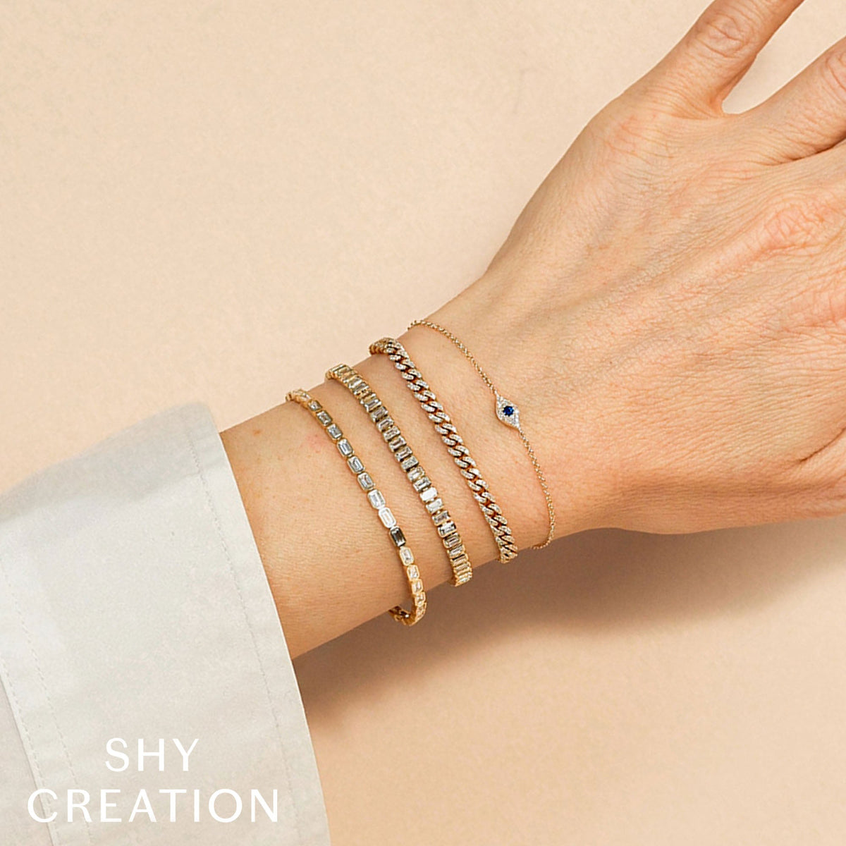 0.04CT DIAMOND & 0.06CT BLUE SAPPHIRE 14K Y/G EYE BRACELET