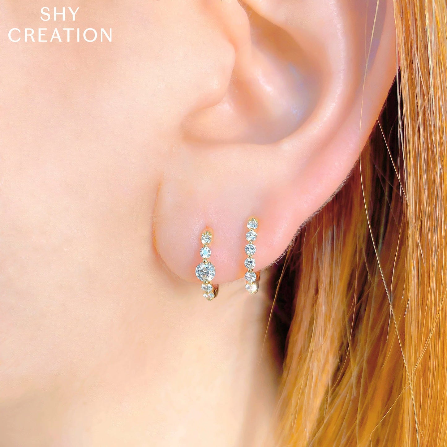 0.26CT 14K Y/G DIAMOND OVAL HUGGIE EARRING