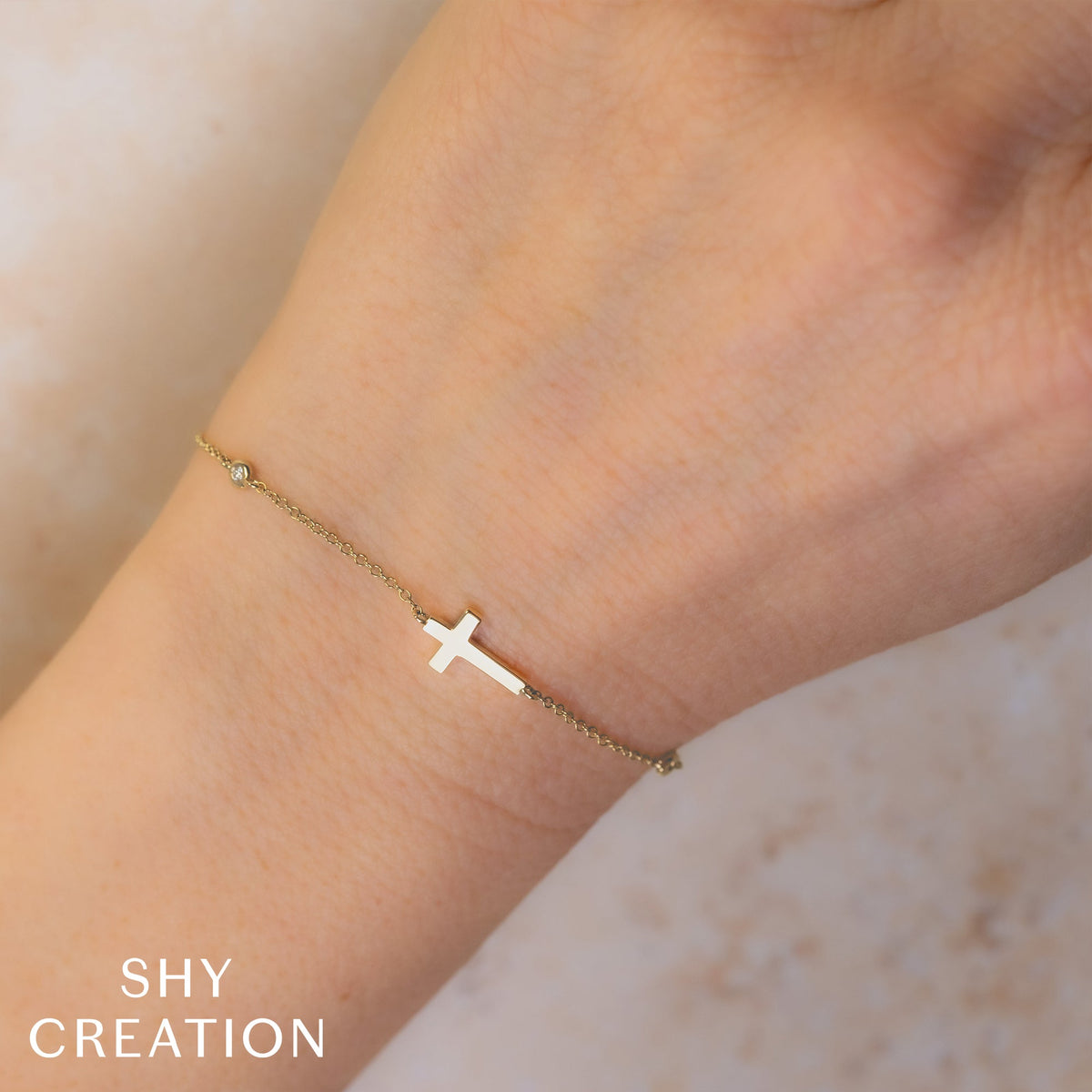 0.03CT 14K W/G DIAMOND BEZEL CROSS BRACELET